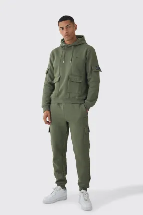 Official Man Regular Fit Panelled Cargo Hooded Tracksuit | boohooMAN UK